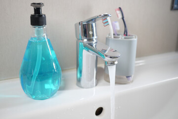 water pouring from a faucet tap slow motion 