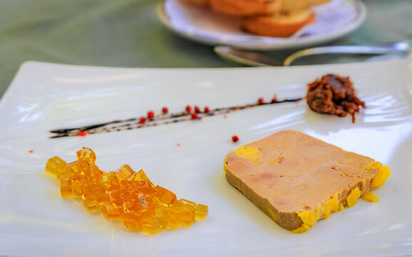 Traditional French mi cuit foie gras duck liver pate with white wine jelly and caramelized onions at a winstub restaurant, Strasbourg, Alsace, France