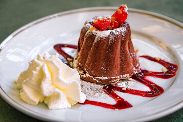 Traditional kugelhopf glace ice cream cake with marc of Gewurztraminer eau de vie fruit brandy, chocolate and strawberries Strasbourg, Alsace, France