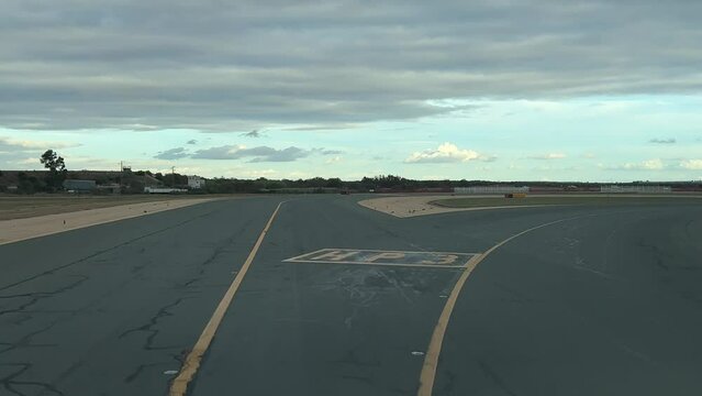 Airplane taxiing as seen by the pilots ready for take-off, shot from the cockpit, in a cold winter day