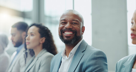 Portrait, group and black man in a workshop, business and conference with planning, feedback and listening. Face, African person and employee in a meeting, staff and employee with seminar and review