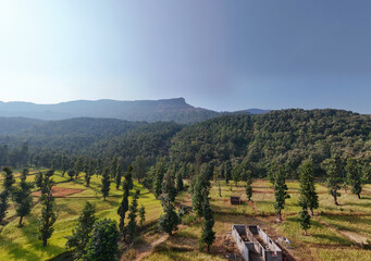 Fototapeta na wymiar Beautiful aerial view of mountain layer in forest. Sahyadri mountain range layers with sun 