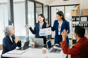 Young business creative team are brainstorming planning discussing while sitting in office
