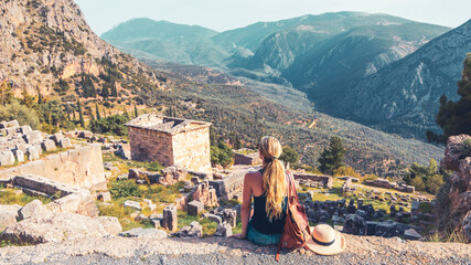 Ancient city of Delphi, ruins of the temple of Apollo, theatre and tourist people