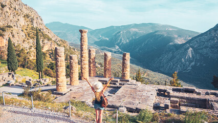 Ancient city of Delphi, ruins of the temple of Apollo and tourist people - Travel, tour tourism in...