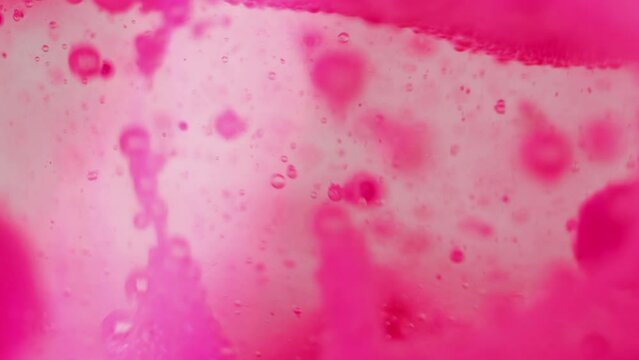 Bubble fluid. Oil texture. Paint water drop. Bright pink color transparent gel foam wet ink air circle motion decorative art abstract background.
