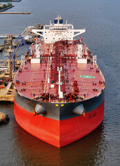 Aerial Close-up View of Oil Tanker Ship in Port at Refinery