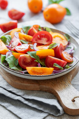 Green salad from leaves and tomatoes