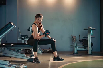 Papier Peint photo Lavable Fitness Fitness asian woman doing exercise and lifting dumbbells weights at sport gym.
