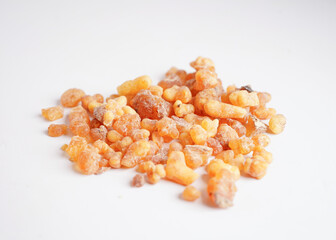 Frankincense or olibanum aromatic resin isolated on white background used in incense and perfumes.