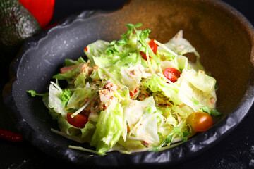 Tuna salad on a black plate
