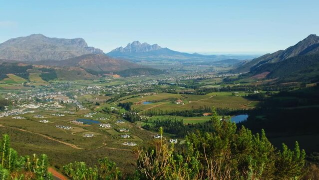 Slider view over lush Franschhoek valley landscape surrounded by mountains