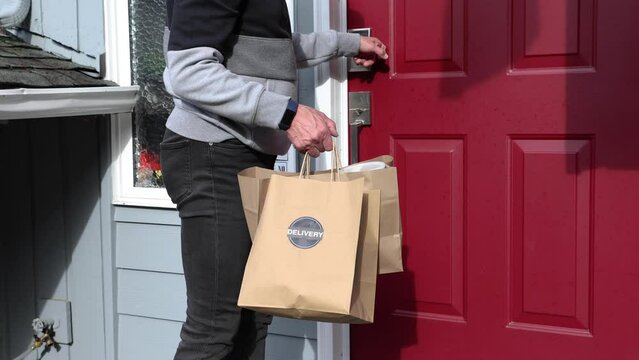 Delivery driver brings the order to the house