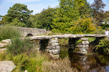 Fototapeta na wymiar Postbridge Dartmoor Medieval Clapper bridge 