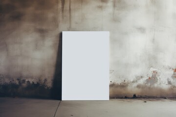 A blank poster mock-up against a concrete wall - obrazy, fototapety, plakaty