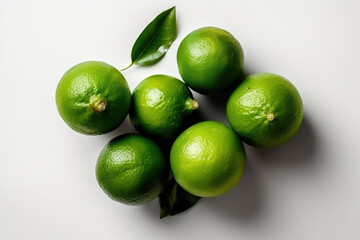top view of  fresh green limes on a white background