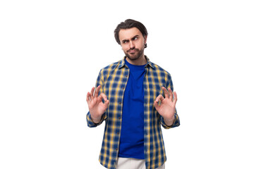 young caucasian brutal man with unshaven face dressed in blue plaid shirt isolated on white...