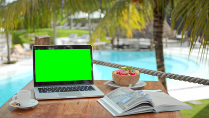 Chroma key display close up. Green screen mock up. Palm tree work cafe. Use clean computer macbook....