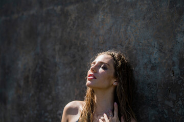 Fototapeta premium Beautiful young woman with clean fresh skin, summer outdoor. Face care, facial treatment, cosmetology, beauty and spa. Sensual women portrait. Fashion make up.