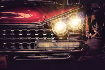 Vintage american car on the road. Retro style toned image