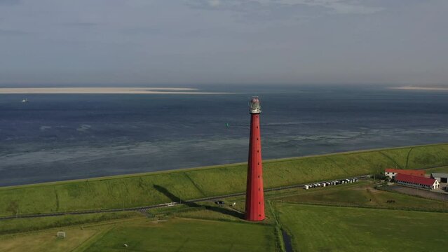 Drone shot, drone flight from the lighthouse Huisduinen, called the long Jaap with the North Sea in the background, Nieuw Den Helder, Huisduinen, province North Holland, Netherlands