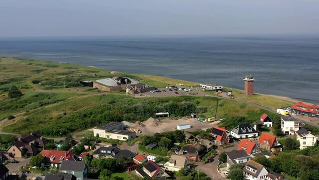 Drone shot from Fort Kijkduin over the village of New Den Helder to the lighthouse Huisduinen, called the long Jaap and the North Sea, Nieuw Den Helder, Huisduinen, province North Holland, Netherlands