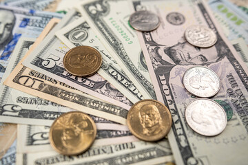 background of ste different us dollar paper money and coin cent