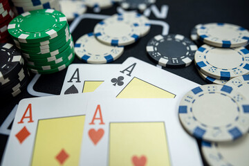 4 four play card with chips on  casino table