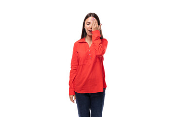 young caucasian model woman with straight black hair dressed in a red blouse closed her eyes