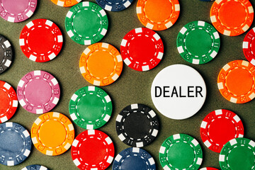 Lots of poker chips on green background