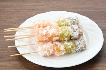 Sentiling or ongol-ongol, Indonesian traditional snack, made from cassava sprinkled with grated coconut
