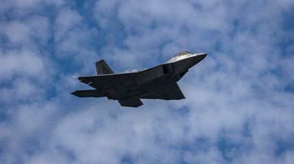 Fototapeta na wymiar Air Force F-22 passes over head
