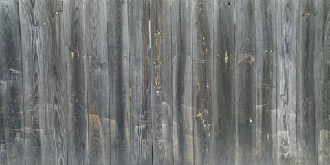 Dark brown wooden plank background for wallpaper in old grunge dark textured brown pine wood paneling