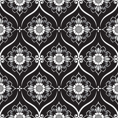 Seamless wallpaper pattern with black and white flowers in a damask design.