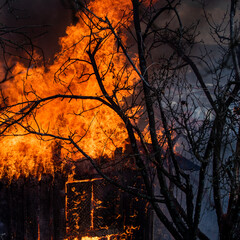 Fire country house. Burning building. Open flames. Burning home. Single family detached home completely destroyed by flames. House fire. Burning building.
