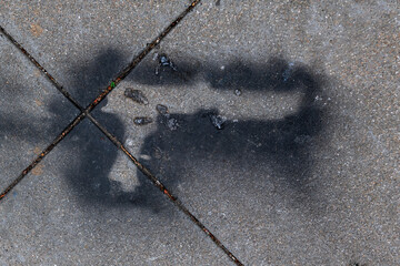 imprint of a gun on the ground
