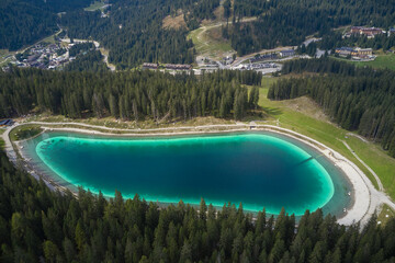 Montagnoli Lake. Aerial view of Trentino Montagnoli lake. Perspective aerial view of the Montagnoli lake in Trentino.  Blue lake in the Alps. Alpine lake in the mountains, top view.