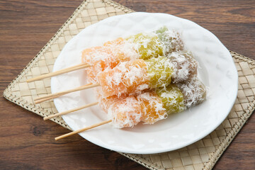 Sentiling or ongol-ongol, Indonesian traditional snack, made from cassava sprinkled with grated coconut
