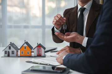 Real estate company to buy houses and land are delivering keys and houses to customers after...