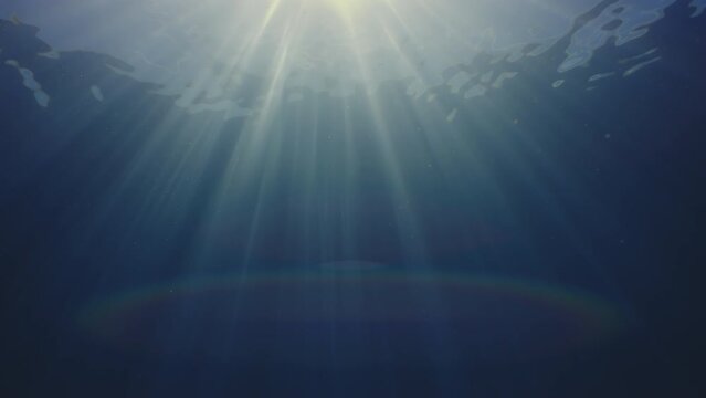 Sun rays in blue water, waves on the water surface, abstract