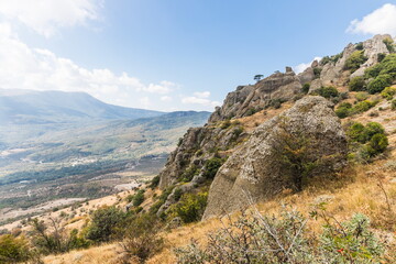 Fototapeta na wymiar Mysterious mountain landscape of the Valley of Ghosts on the western slope of Mount Demerdzhi in Crimea. Popular tourism and trekking destination
