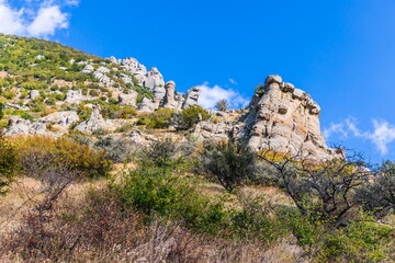 Mysterious mountain landscape of the Valley of Ghosts on the western slope of Mount Demerdzhi in Crimea. Popular tourism and trekking destination