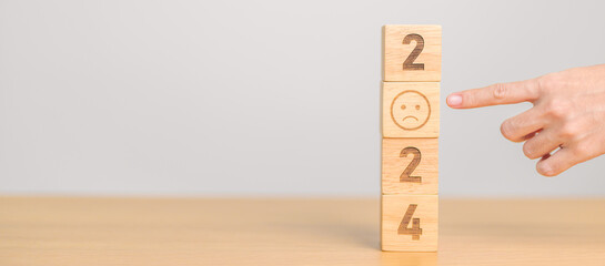 sad face with 2024 block.  Satisfaction, feedback, Review, mental health, eco sustainable and Happy New Year concept