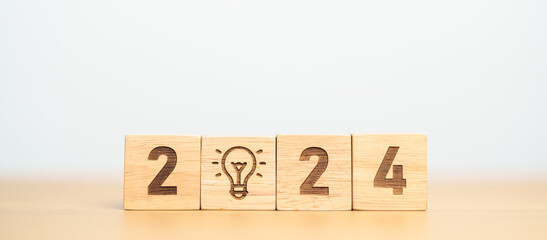 2024 block with lightbulb. Business Idea, Creative, Thinking, brainstorm, Goal, Resolution,...