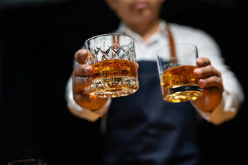 Barman pouring whiskey whiskey glass beautiful night