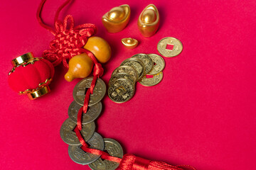 Traditional chinese new year decoration knots on red background.