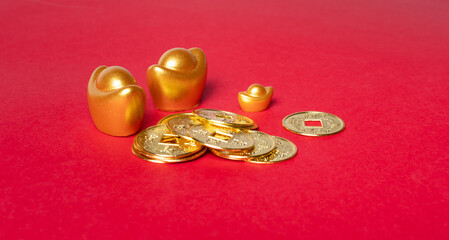 Traditional chinese coins, chinese new year concept, on red background.