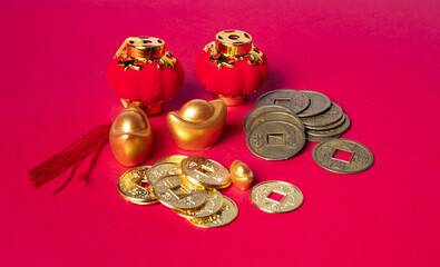 Traditional chinese coins and ingot, chinese dragon new year concept, on red background.