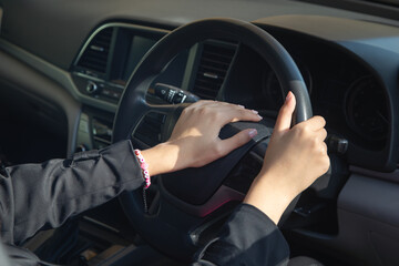 Naklejka premium Caucasian woman driver honking a car.