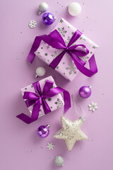 Celebrate joyously with vertical top view of lilac gift boxes, gleaming baubles, vibrant stars, and...